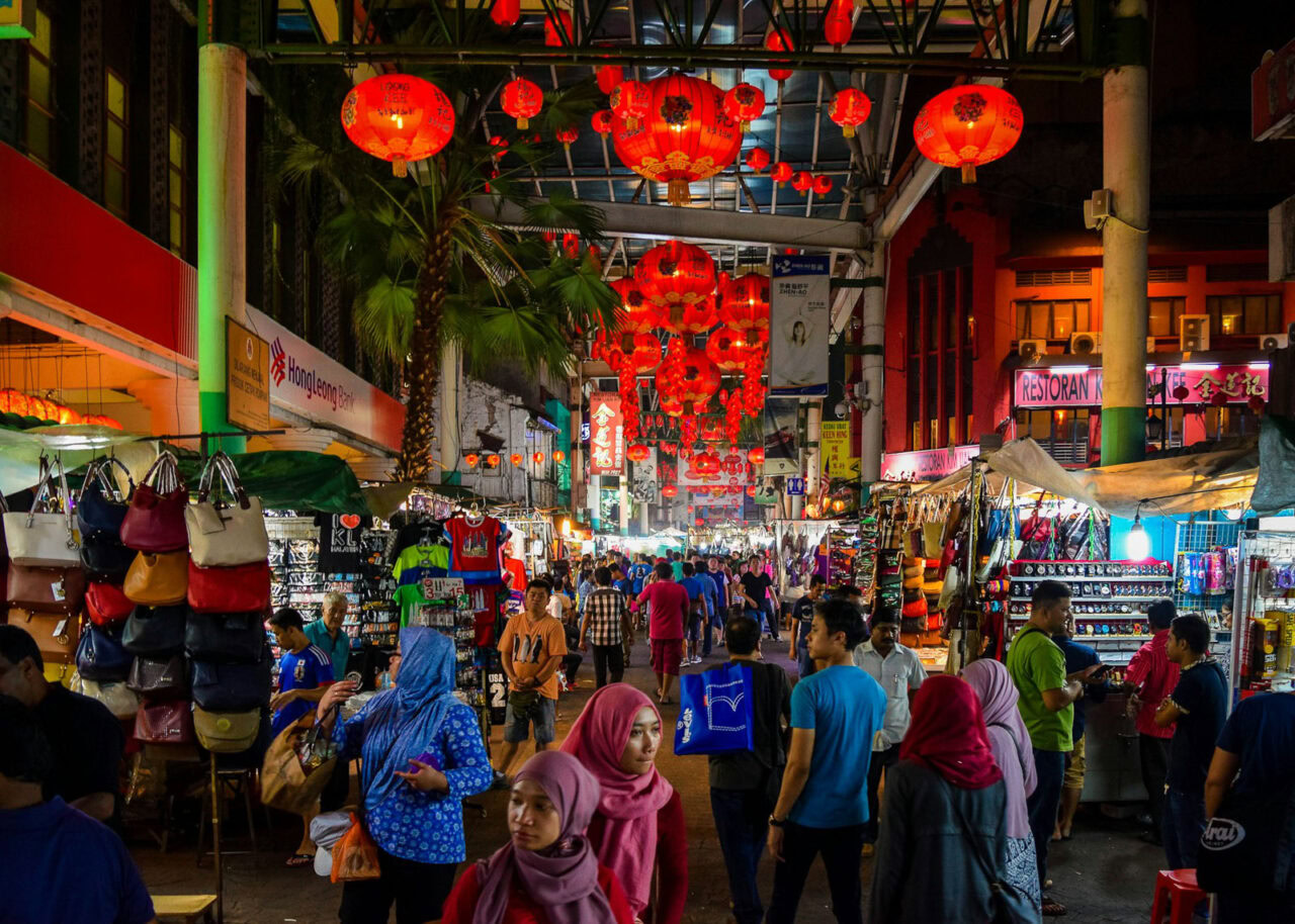Crowded shopping street in Kuala Lumpur at night